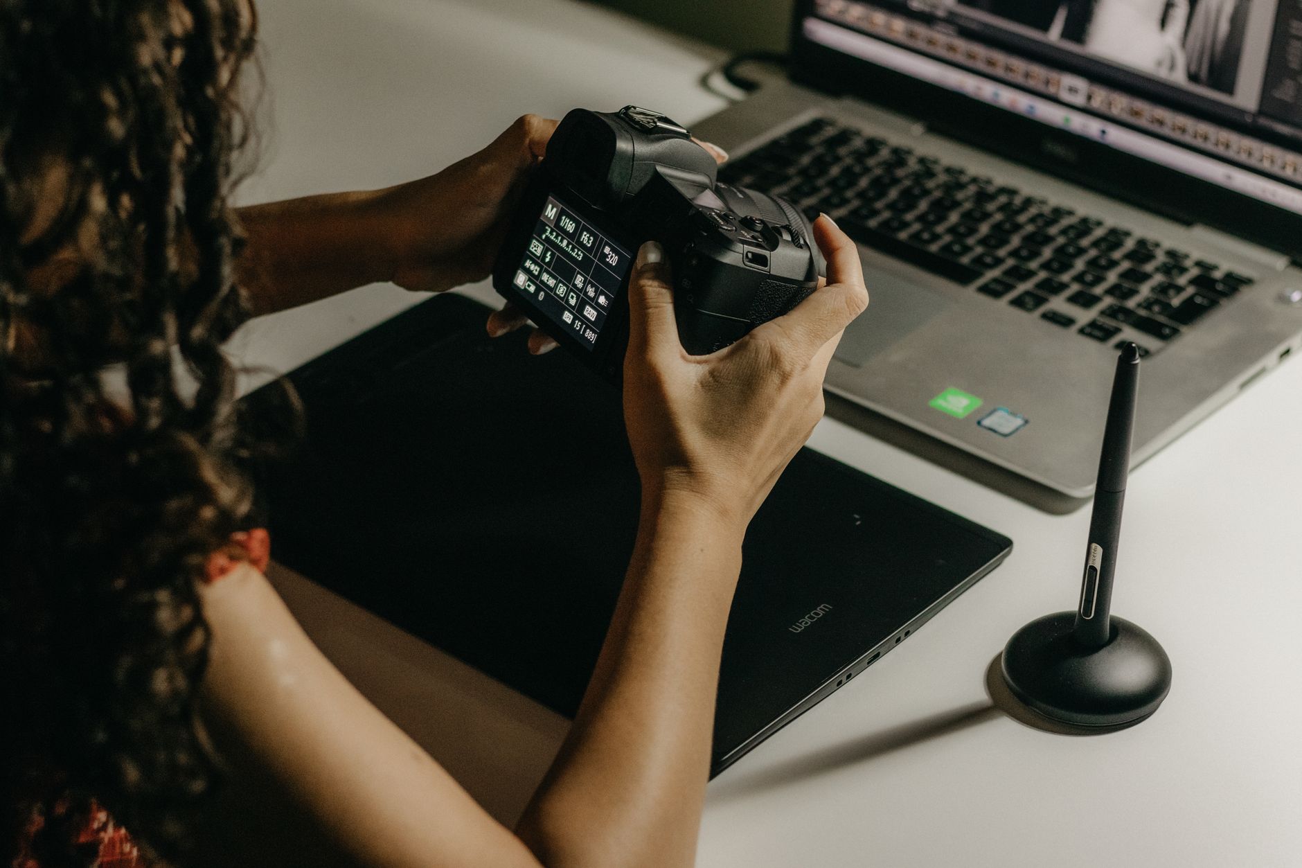 a photographer editing a portrait with Lightroom AI masks on a computer screen