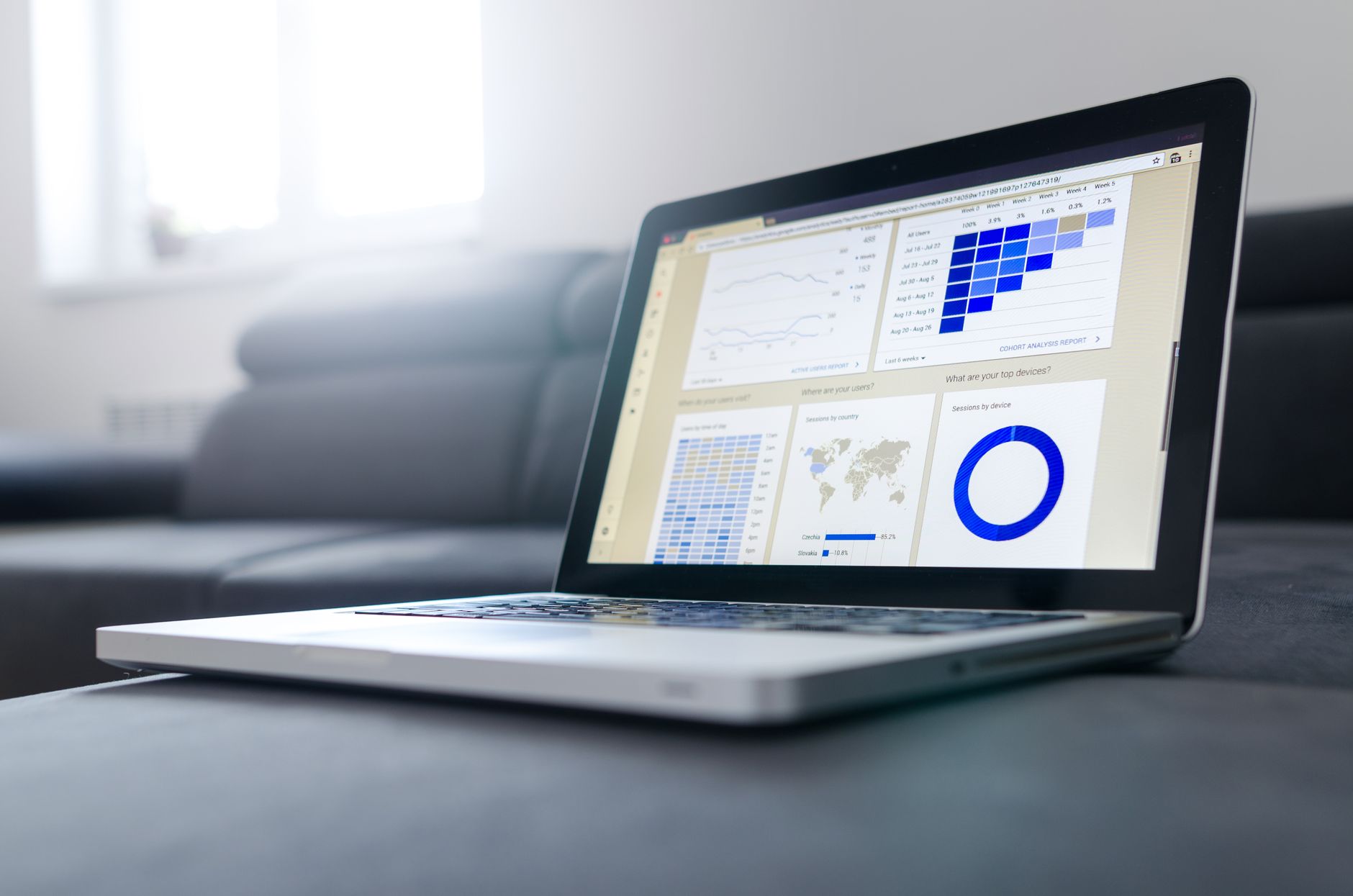 A laptop showing an automation workflow dashboard with invoice data fields