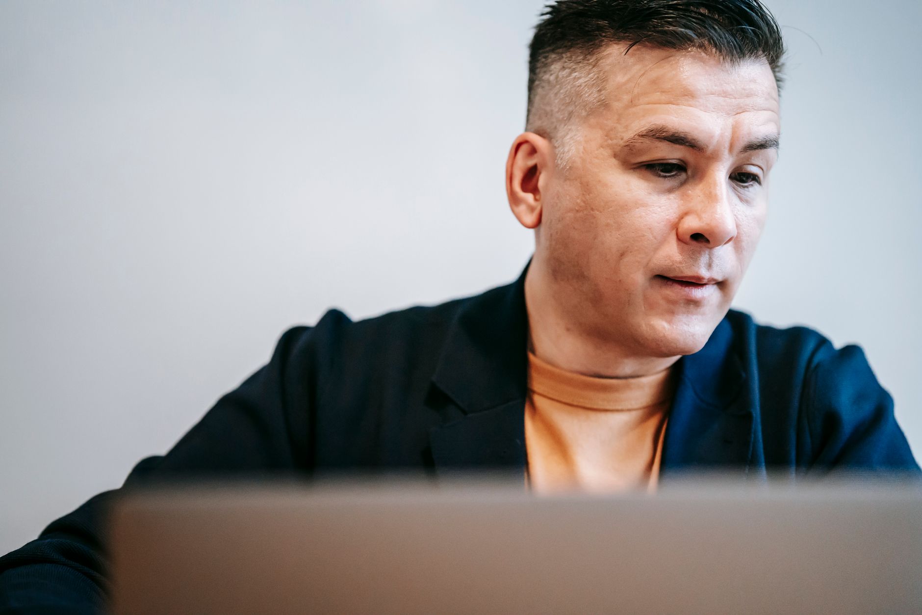 a salesperson viewing a contact database on a laptop screen