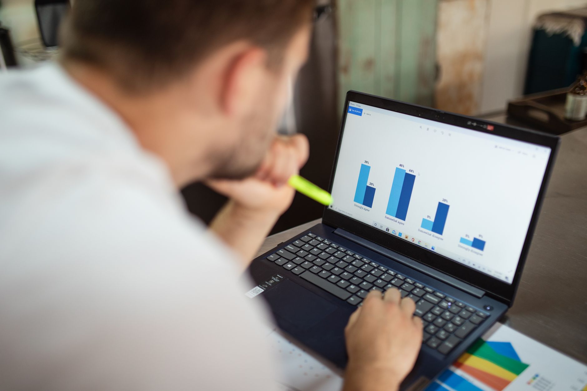 an HR analyst looking at hiring funnel charts on a computer monitor