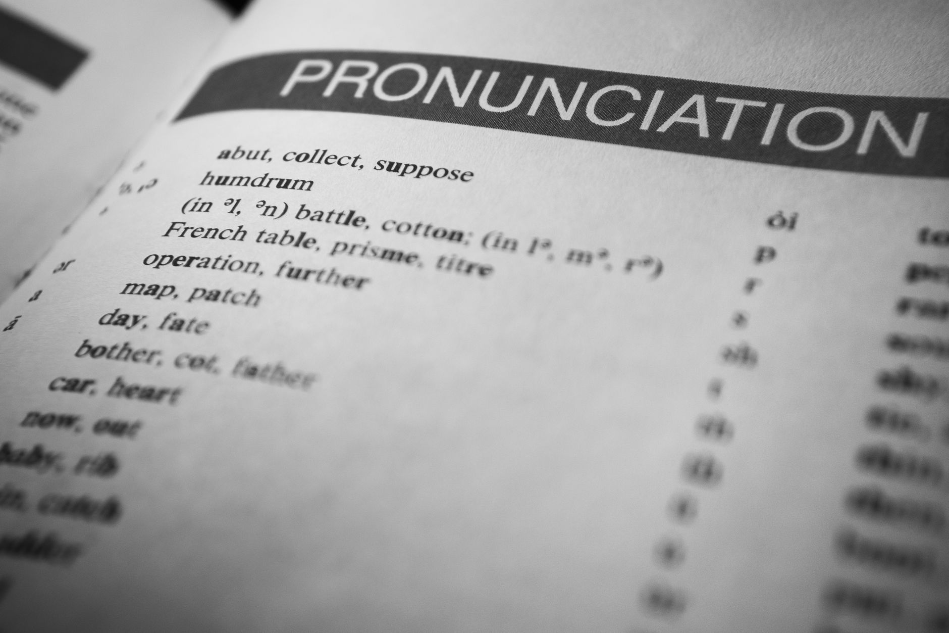 a person editing a glossary in translation software on a desktop computer