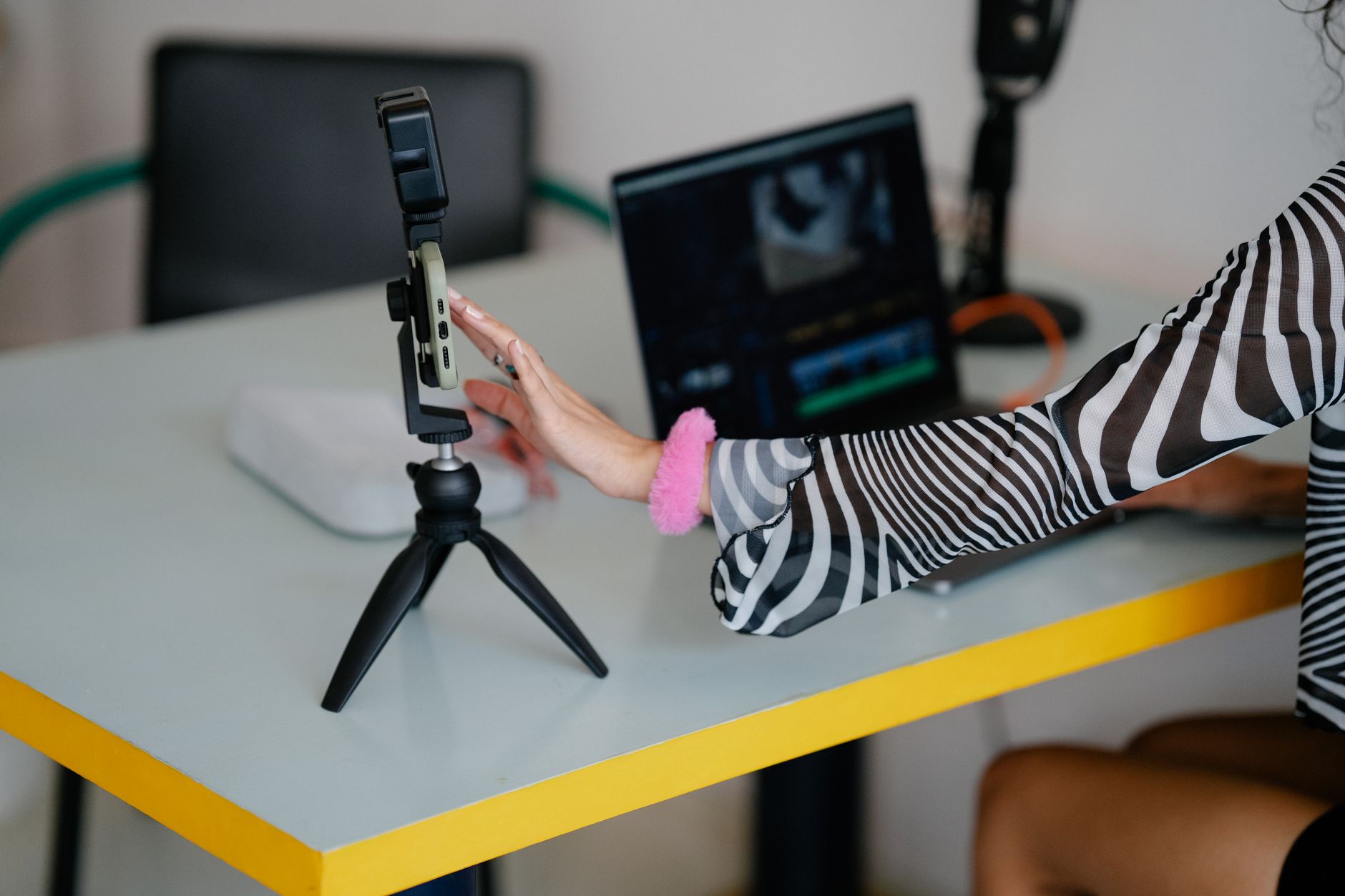 content creator editing vertical smartphone video with captions on screen