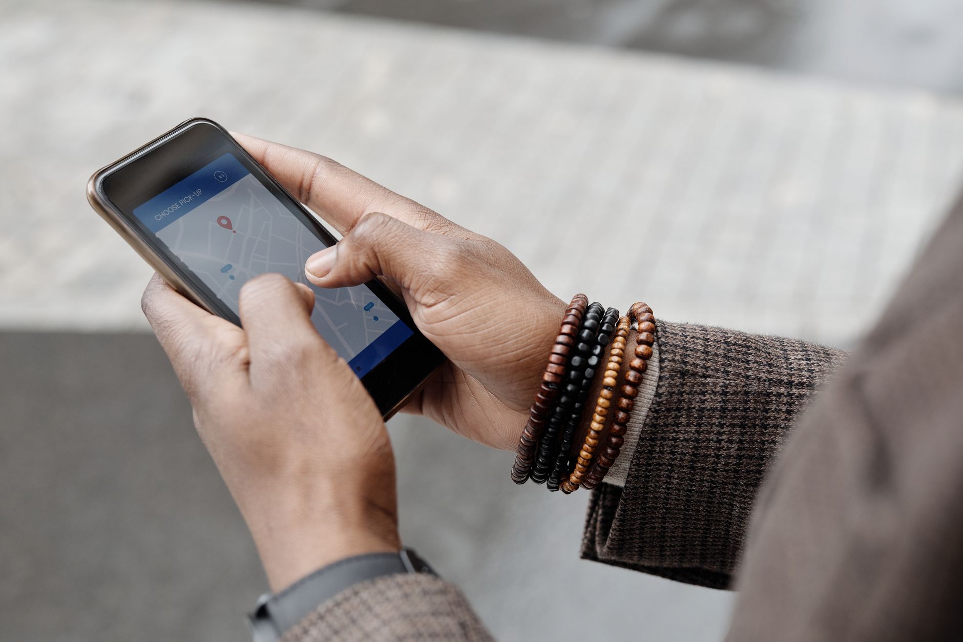 Person holding a smartphone with the Google Gemini app interface visible on screen