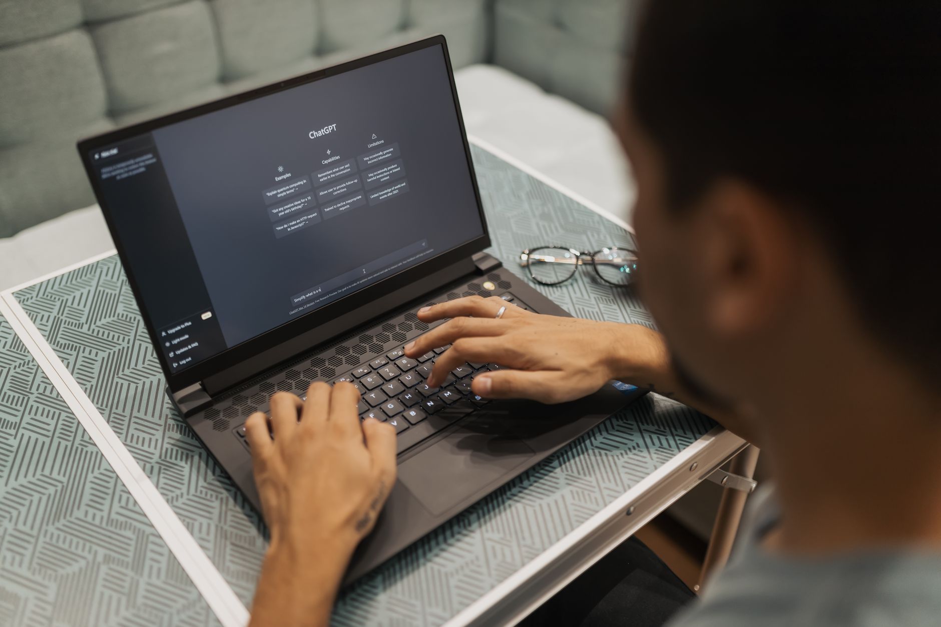 Laptop screen displaying a grammar checking software interface with text analysis