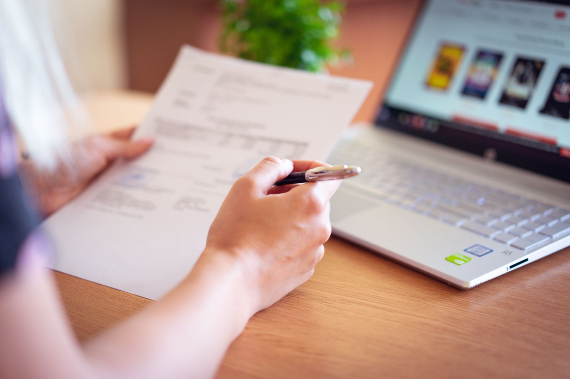 Person reviewing a long document on a laptop screen