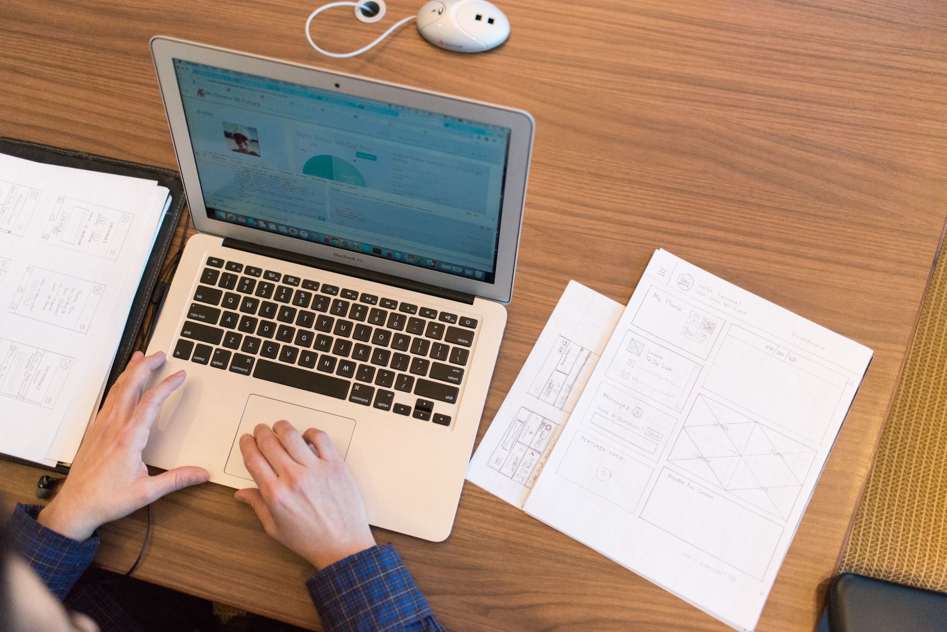 a person organizing customer support documents on a laptop screen