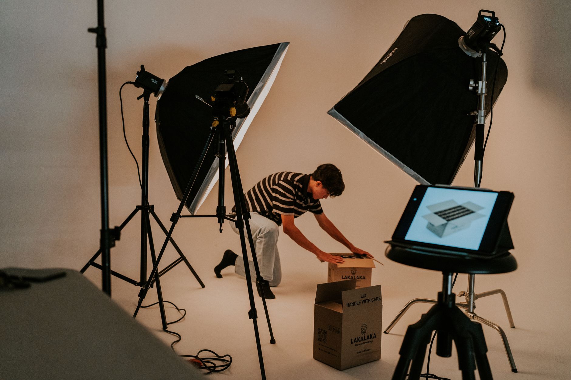 A designer turns a still product photo into an animated video on a desktop monitor